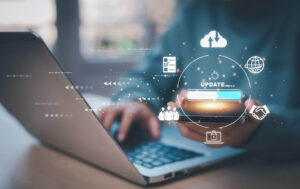 Website redesign process shown on a laptop with digital update icons, representing improved SEO and AI search visibility.