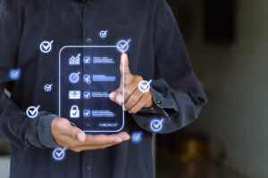 A person in a dark shirt interacting with a digital checklist interface projected in front of them.