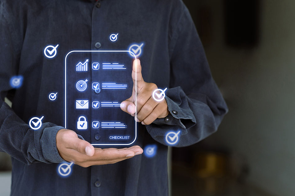 A person in a dark shirt interacting with a digital checklist interface projected in front of them.